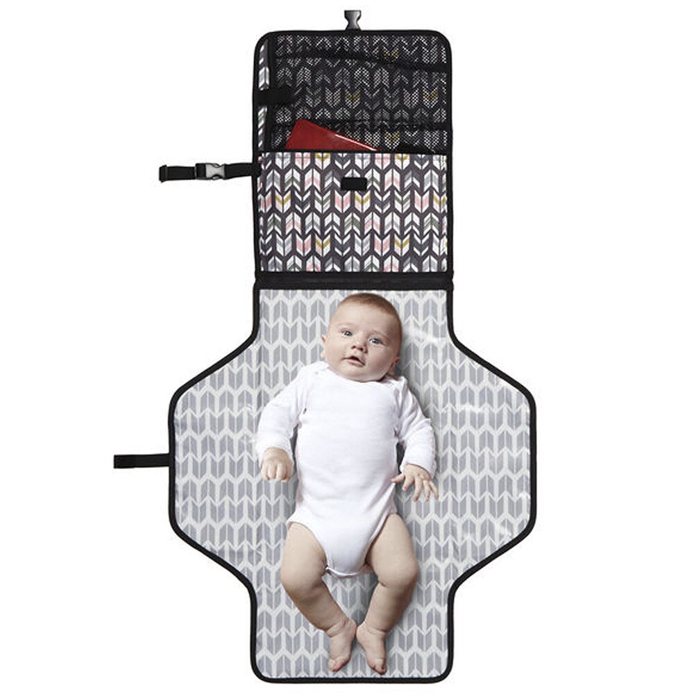 baby boy on skip hop changing station